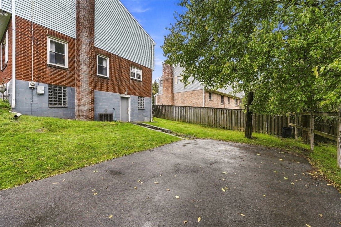 Plenty of room to park! This spacious driveway can accommodate approximately four vehicles.
