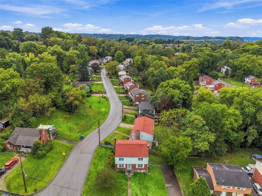 Enjoy the added privacy of a spacious corner lot alongside a quiet no-outlet road.