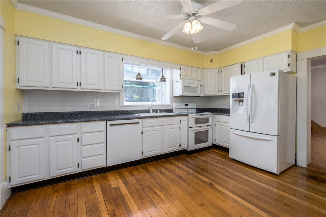 14'4" X 11'5" FULLY EQUIPPED KITCHEN WITH WINDOW BOX AND SO MUCH NATURAL LIGHT.