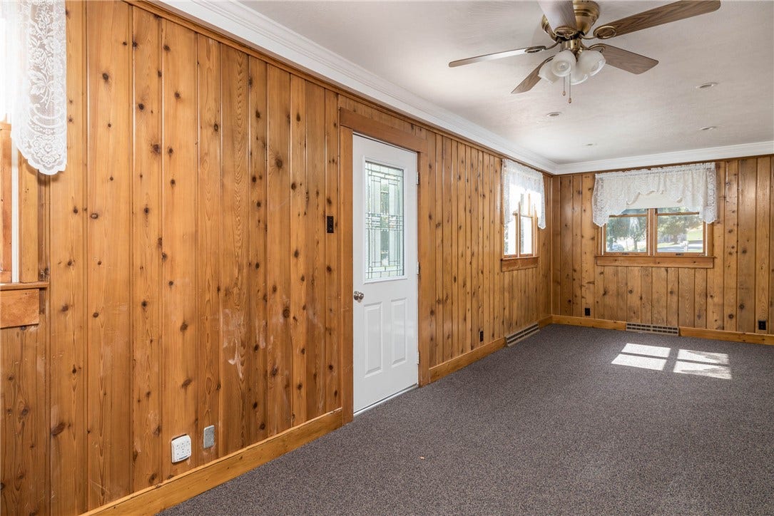 26'6" X 9'7" FRONT FOYER.  THIS ROOM WAS USED AS A HOME OFFICE.  THE DOOR IS THE FRONT EXTERIOR DOOR