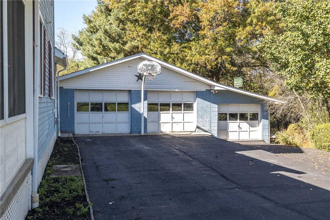 DETACHED 3 CAR GARAGE WITH PLENTY OF STORAGE AND EASY ACCESS TO THE BACK PORCH ENTRANCE.