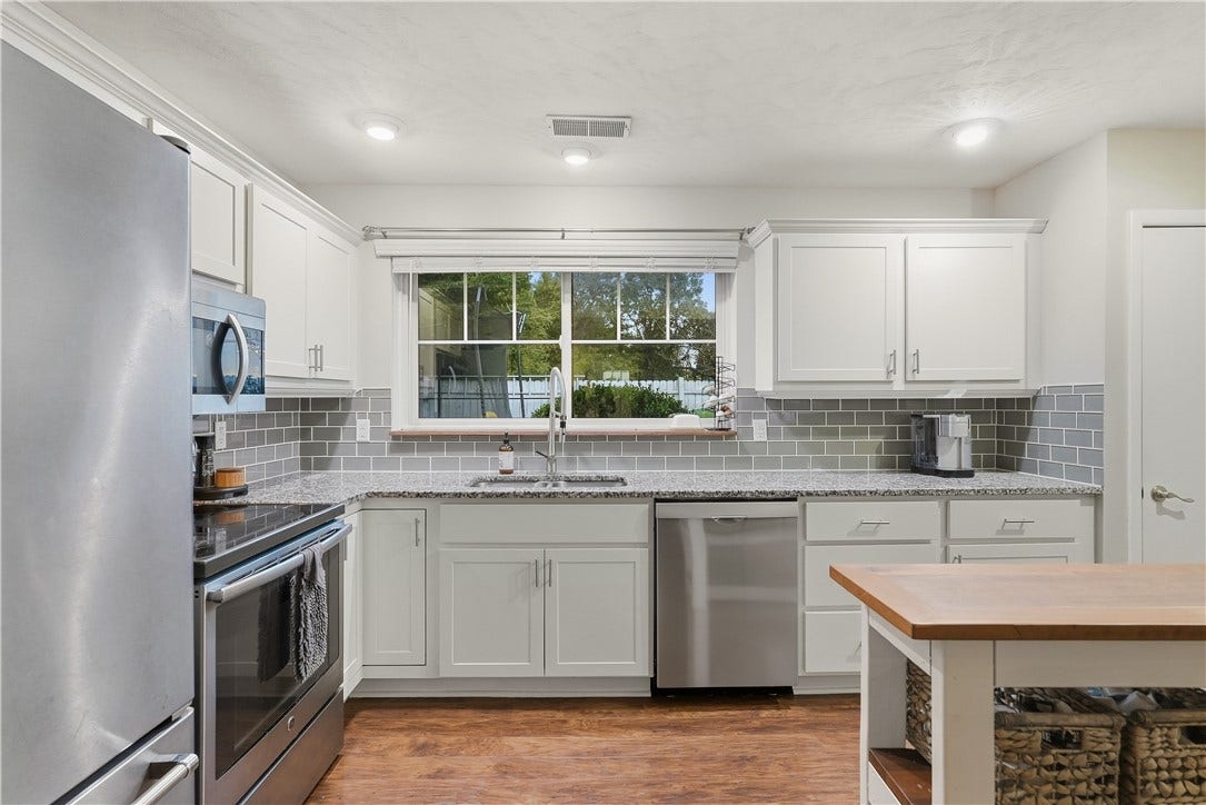 Remodeled Kitchen with white shaker cabinets, stainless steel appliances and granite tops!