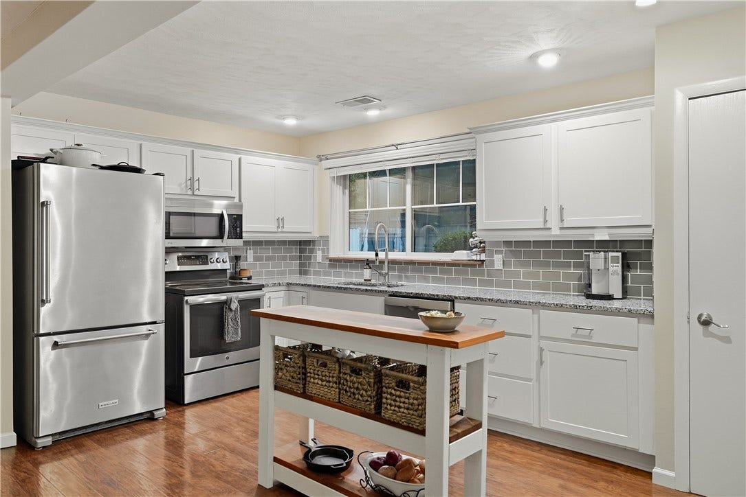 Remodeled Kitchen with white shaker cabinets, stainless steel appliances and granite tops!