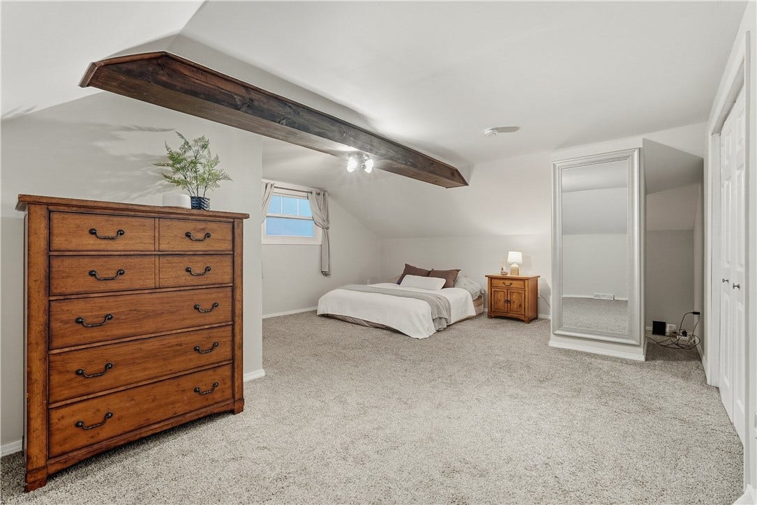 BR3. Second floor primary BR that has a double closet, vaulted ceiling and private full bath with shower.