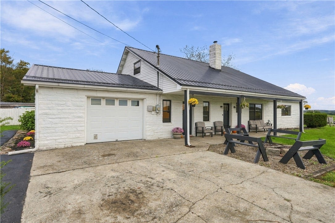 Oversized garage that is 28' Deep x 16' Wide, with 13' high ceiling.  Man door in rear of garage to backyard.