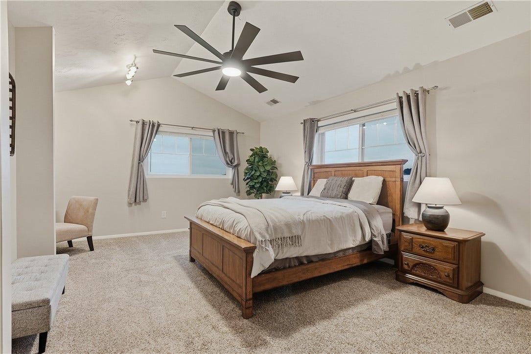 Bright 1st Floor Primary Bedroom with double closet and niche for future second closet or desk area. Vaulted ceilings with new fan/light.