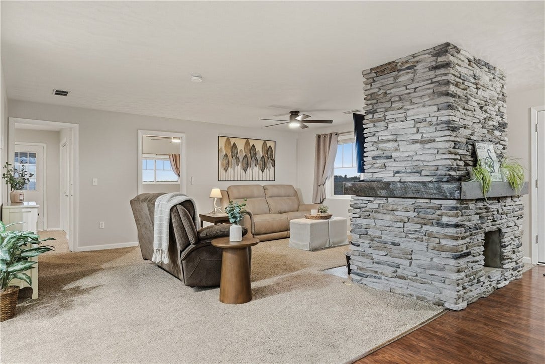 Cozy Living Room with wood burning fireplace for extra warmth in the cold months