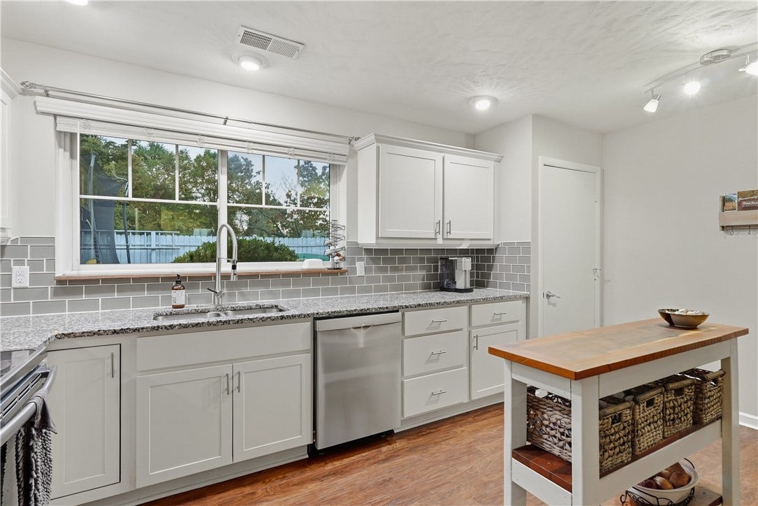 Remodeled Kitchen with white shaker cabinets, stainless steel appliances and granite tops!
