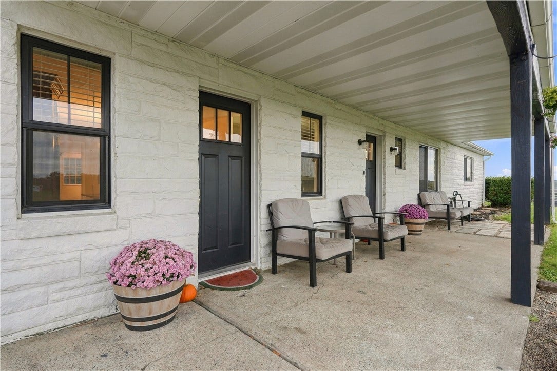 Large covered front porch for relaxing and enjoying the sunsets!