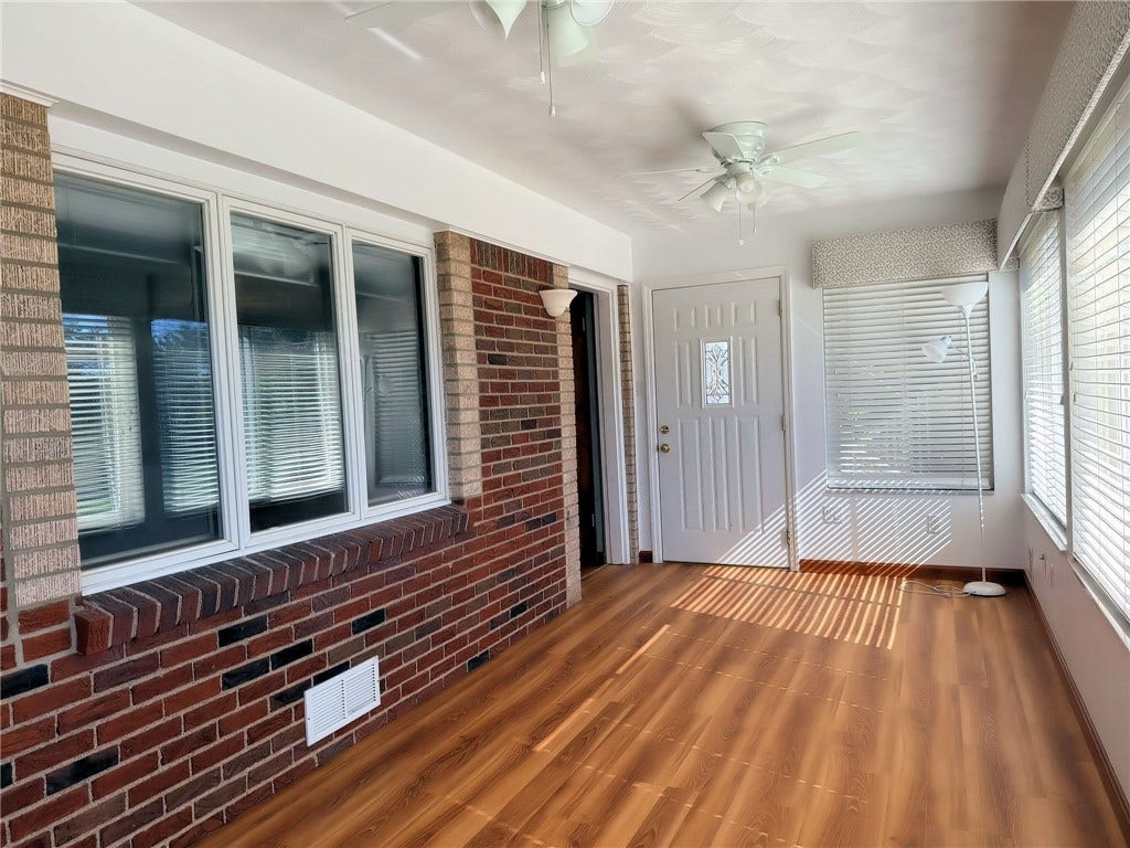This heated and air conditioned room is a true 4 season room.  The room drips with natural light from the large windows!