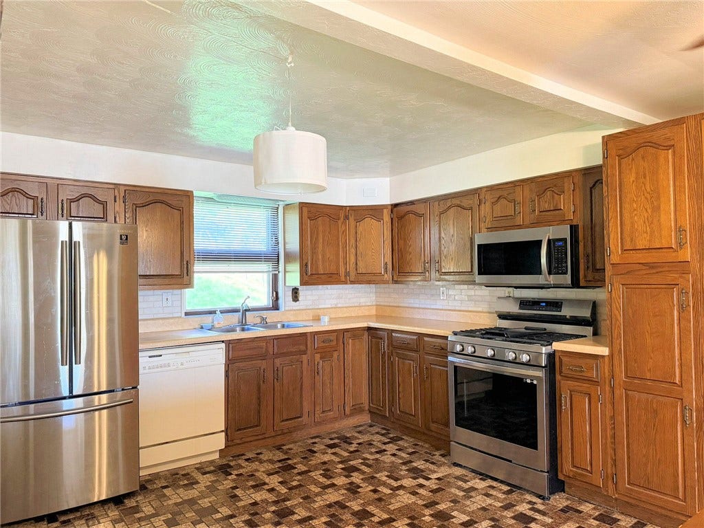 This kitchen is solid.  The cabinetry is in good condition.  This is move in and decide what you want the kithen to be.