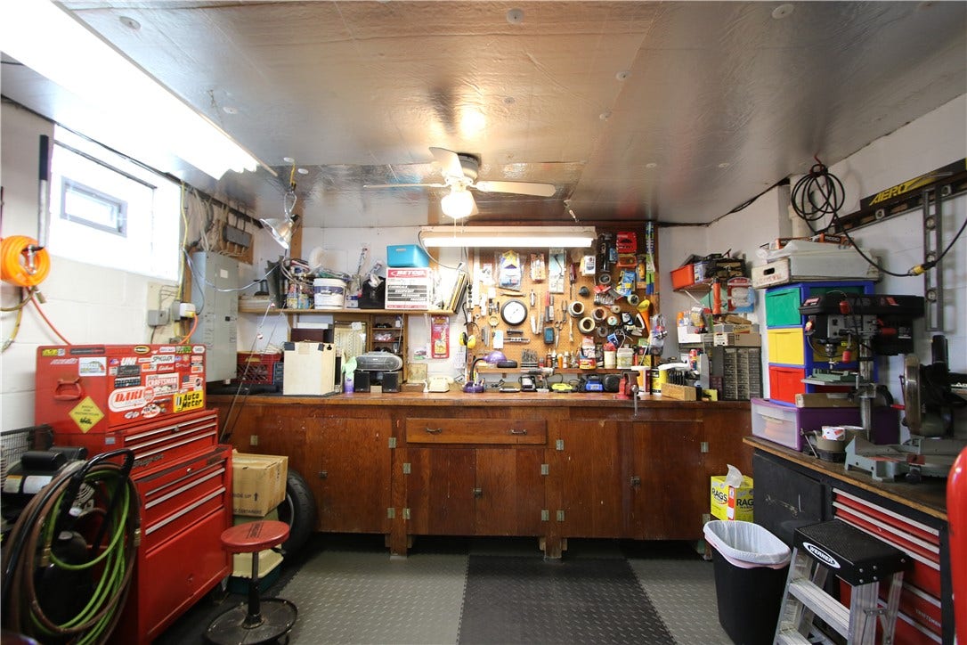 4239 Finleyville Elrama Road, Finleyville, PA 15332 Built-in Wood Bench w/ Cabinets in Garage. Glass Block Windows w/ Vents in Lower Level