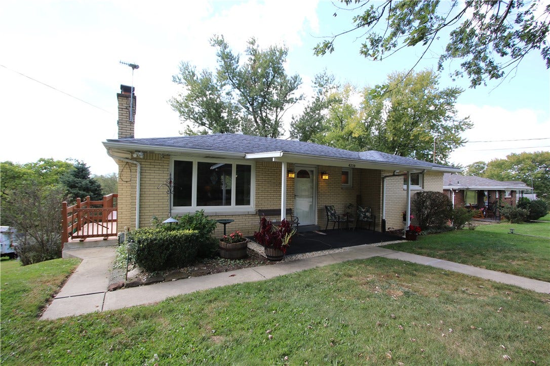 4239 Finleyville Elrama Road, Finleyville, PA 15332 Quality Built Level Entry Brick Ranch offering Original Hardwood Floors, Plaster Walls, some accented by Coved Ceilings & Marble Window Sills!