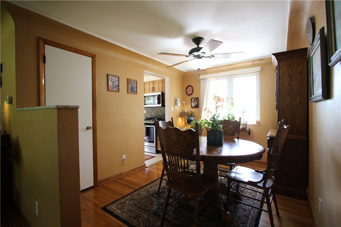 4239 Finleyville Elrama Road, Finleyville, PA 15332 Another View of Formal Dining Room Complemented by Wood Baseboard Trim work, Marble Top 1/2 Wall separating Living Room & Deep Pantry Closet leading to Attic