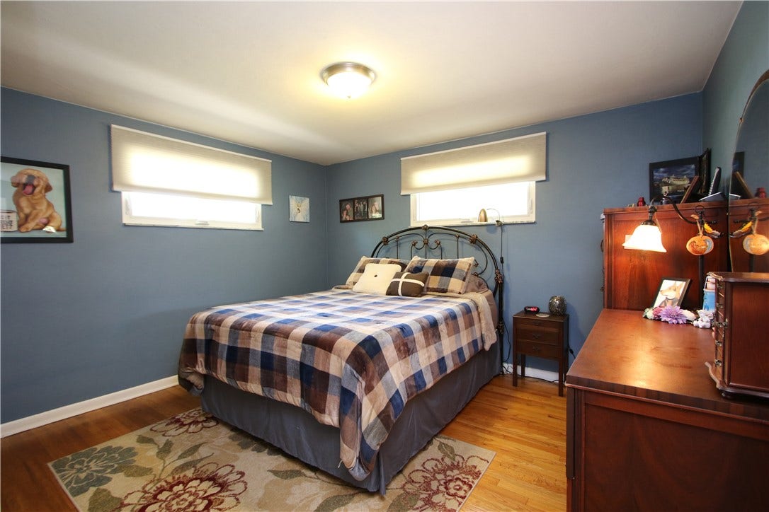 4239 Finleyville Elrama Road, Finleyville, PA 15332 Hardwood Floors in 12x11 Primary Bedroom w/ 2 Windows enhanced with Marble Sills