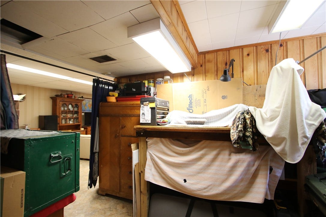 4239 Finleyville Elrama Road, Finleyville, PA 15332 Another 11x8 area off of Game Room, perfect for a Den, Hobby area, Exercise Room or whatever you desire accented w/ Knotty Pine Paneling. Laundry Chute in this area (top left corner in photo is opening for Chute from Bathroom)
