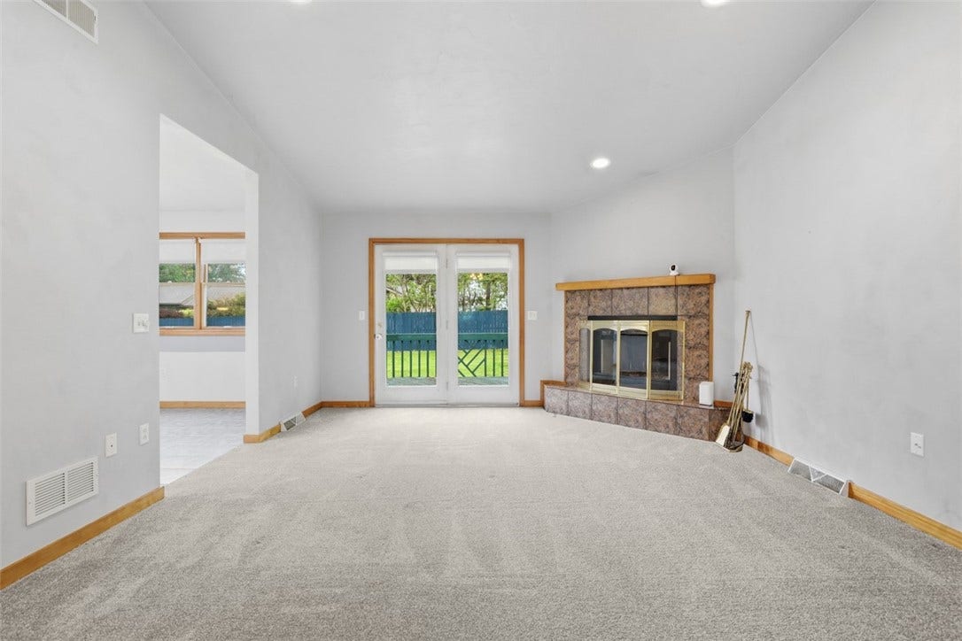 2757 Edith Street, Lower Burrell, PA 15068 French doors to back yard. Recessed lighting over the fireplace.