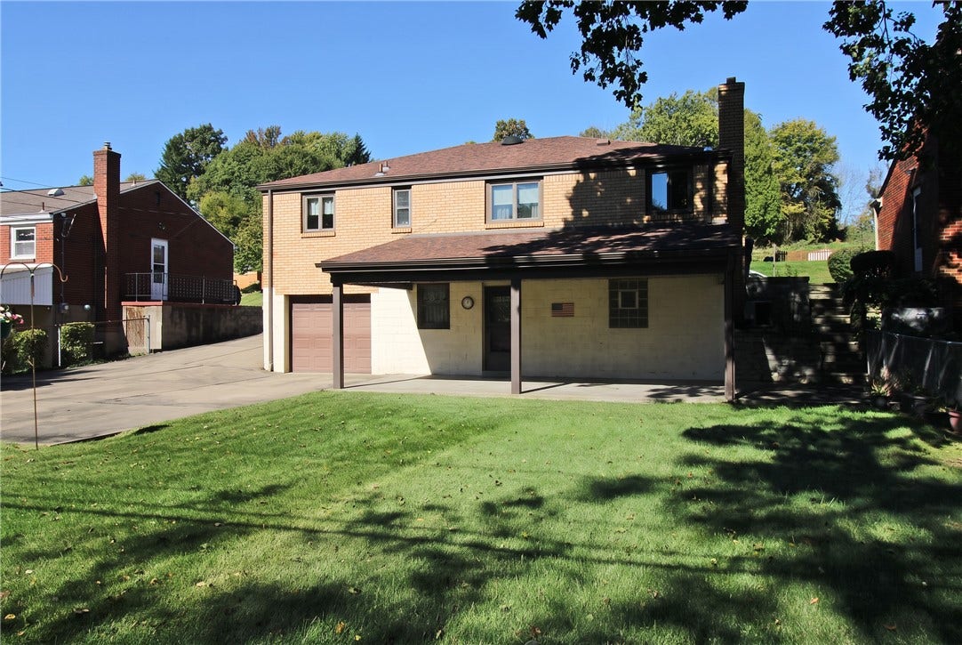 Rear view of the level yard for family gatherings.