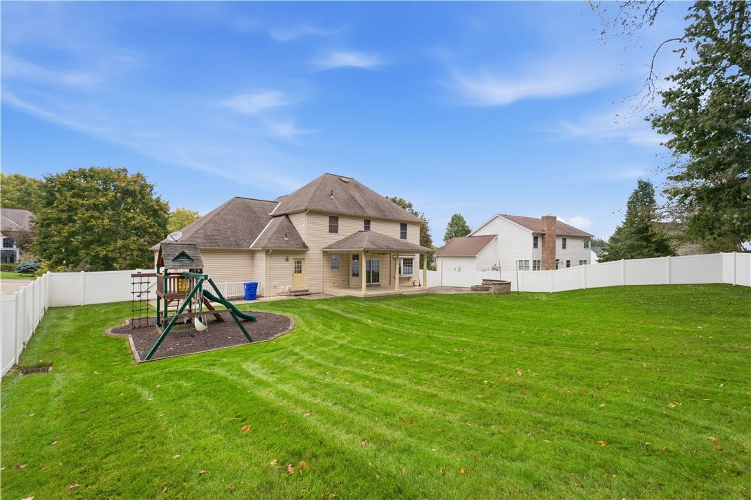The beautiful, almost level, fenced-in back yard is a great size!