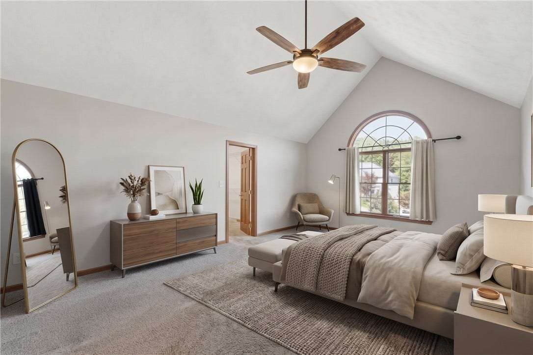 The large Primary Bedroom is approximately 13'x19' and features a vaulted ceiling, Palladium window, large walk-in closet, and gorgeous en-suite bathroom with double sinks, a soak tub, standalone shower, and even heated floors!The Primary Bedroom has been virtually staged to inspire decorating ideas!
