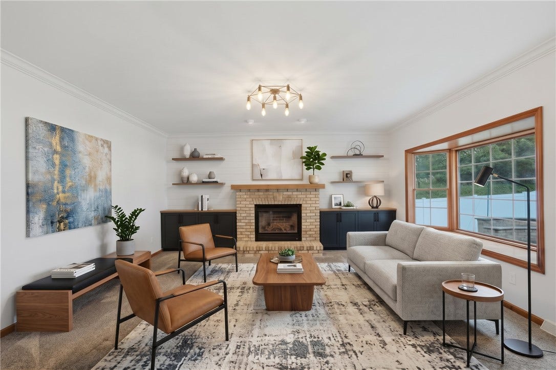 The Living Room is approximately 15'x17' and flows right from the kitchen, creating a very open-concept feel. The living room features a big, beautiful bay window, gas fireplace, and custom, built-in cabinets. The Living Room has been virtually staged to inspire decorating ideas!