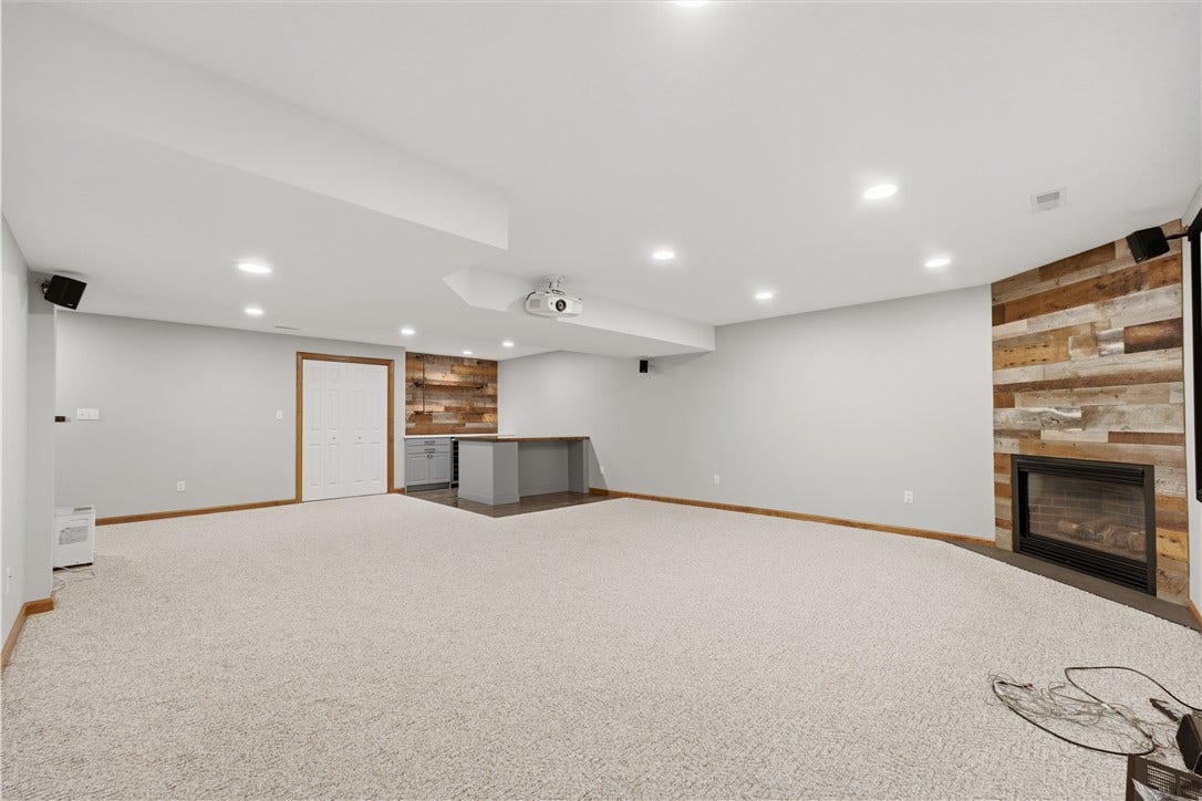 The Basement Game Room is approximately 19'x27' and features a very nice dry bar area, fireplace, tons of room for furniture, recessed lighting, and even a projection screen and projector! What an entertainment room!