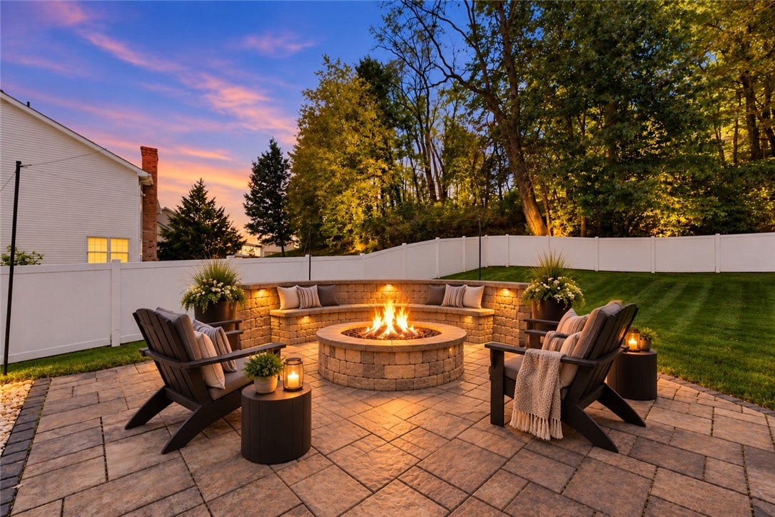 Imagine a cozy fire at the fire pit as the evening turns to twilight. This photo has been digitally staged to inspire decorating ideas.
