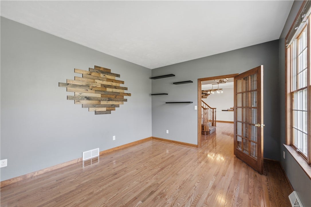 The Den is approximately 13'x12'. This room is very versatile and could be used for a family room, office, sitting room, or even a play room for the kids!