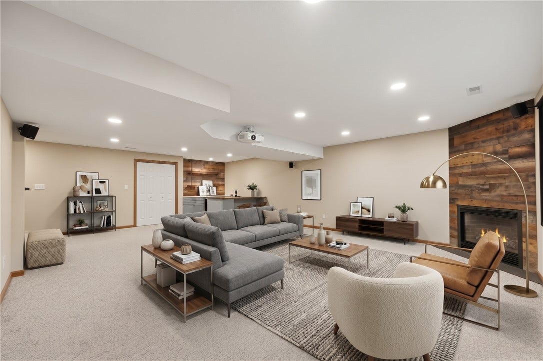 The Basement Game Room is approximately 19'x27' and features a very nice dry bar area, fireplace, tons of room for furniture, recessed lighting, and even a projection screen and projector! What an entertainment room!The Basement Game Room has been virtually staged to inspire decorating ideas!
