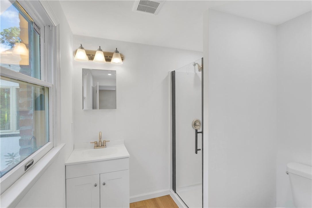 3909 Glencoe Court, Murrysville, PA 15668 Completely renovated Primary Bath with New glass door shower, vanity, flooring, and toilet.