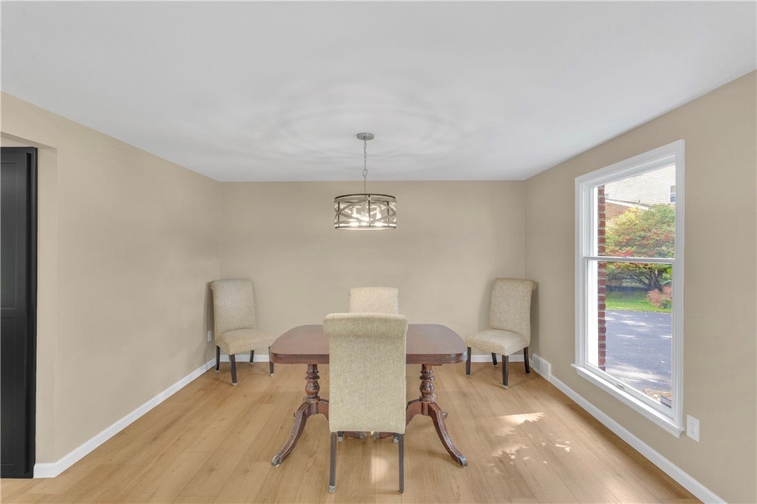 3909 Glencoe Court, Murrysville, PA 15668 New lighting in the 13x12 dining room, open to the kitchen for easy entertaining and dining.