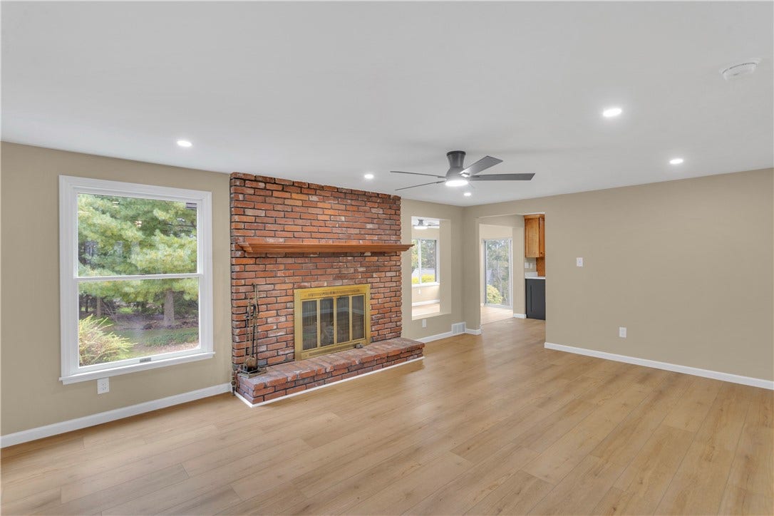 3909 Glencoe Court, Murrysville, PA 15668 19x13 with gas log, bricked fireplace, new ceiling fan and recessed lighting. Open to Kitchen and Sunroom.