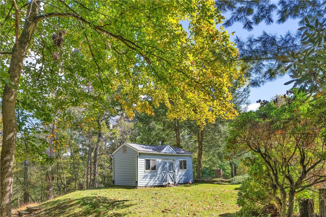3909 Glencoe Court, Murrysville, PA 15668 Storage shed in the back yard with double door entry and windows.