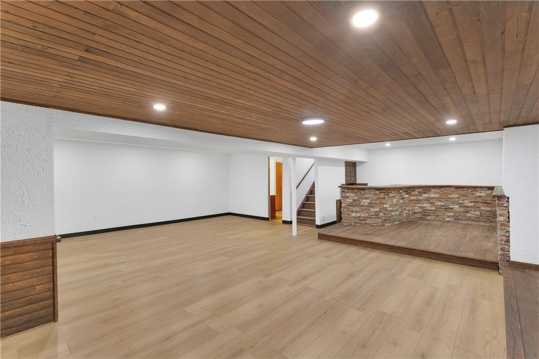 3909 Glencoe Court, Murrysville, PA 15668 Spacious, Finished Lower Level Game Room with raised bricked bar area and full bath.
