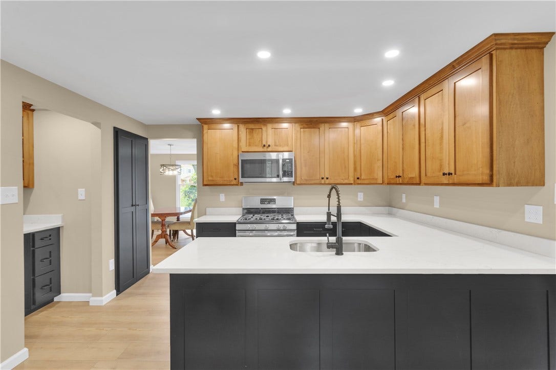 3909 Glencoe Court, Murrysville, PA 15668 Convenient built in beverage area & pantry in the kitchen leading to the dining room - ideal for entertaining.