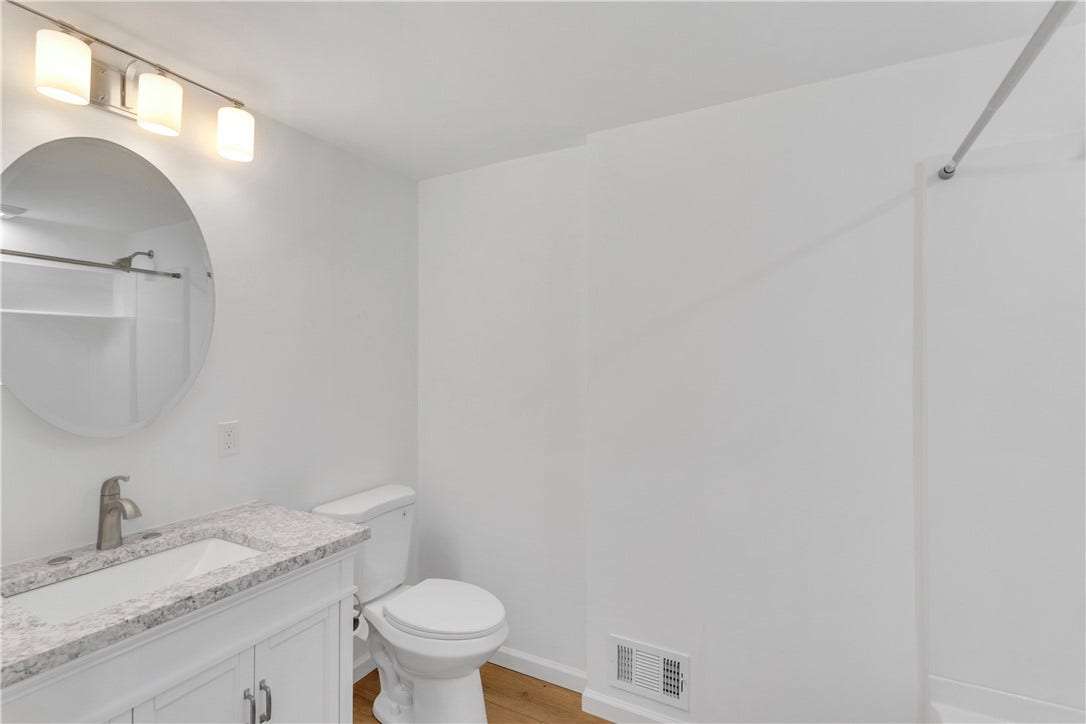 3909 Glencoe Court, Murrysville, PA 15668 All New main level hallway bath with all new tile-look tub/shower, vanity and lighting.