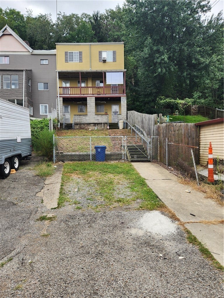 5623-5625 Carnegie St, Pittsburgh, PA 15201 rear of property with 2 off-street parking spots