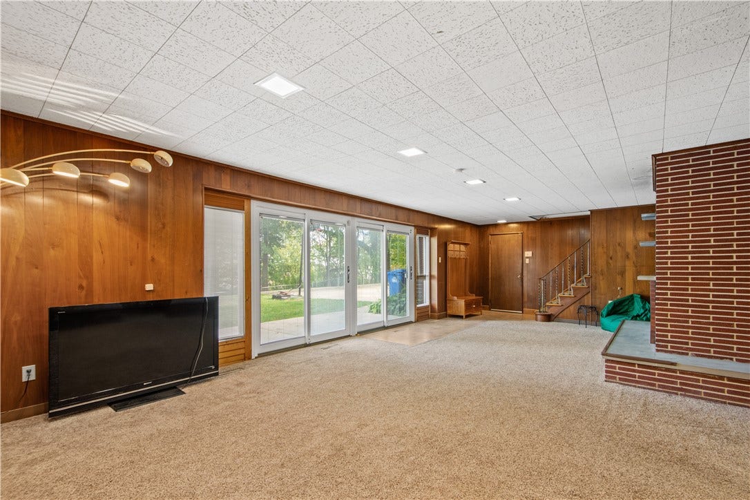 4742 Jewel Dr, Pittsburgh, PA 15236 The walk-out lower level game room is the ideal spot for entertaining both indoors and out.