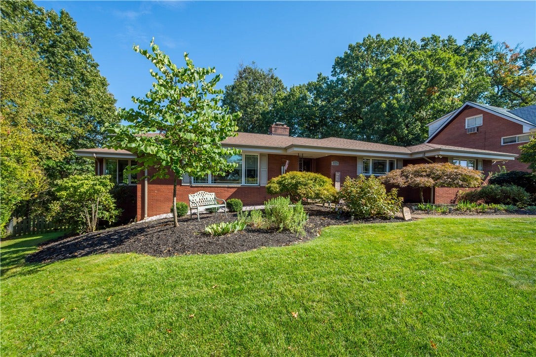 4742 Jewel Dr, Pittsburgh, PA 15236 Meticulously maintained landscaping sets the tone.