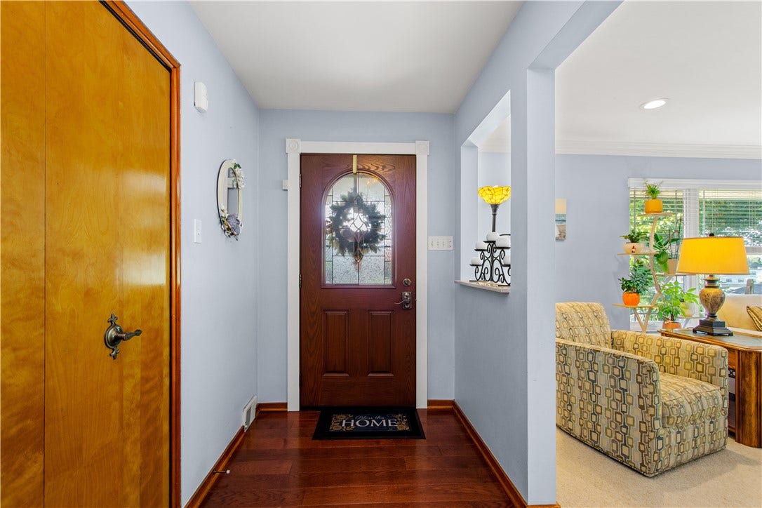 4742 Jewel Dr, Pittsburgh, PA 15236 Hardwood floors continue from the entry to the dining room.