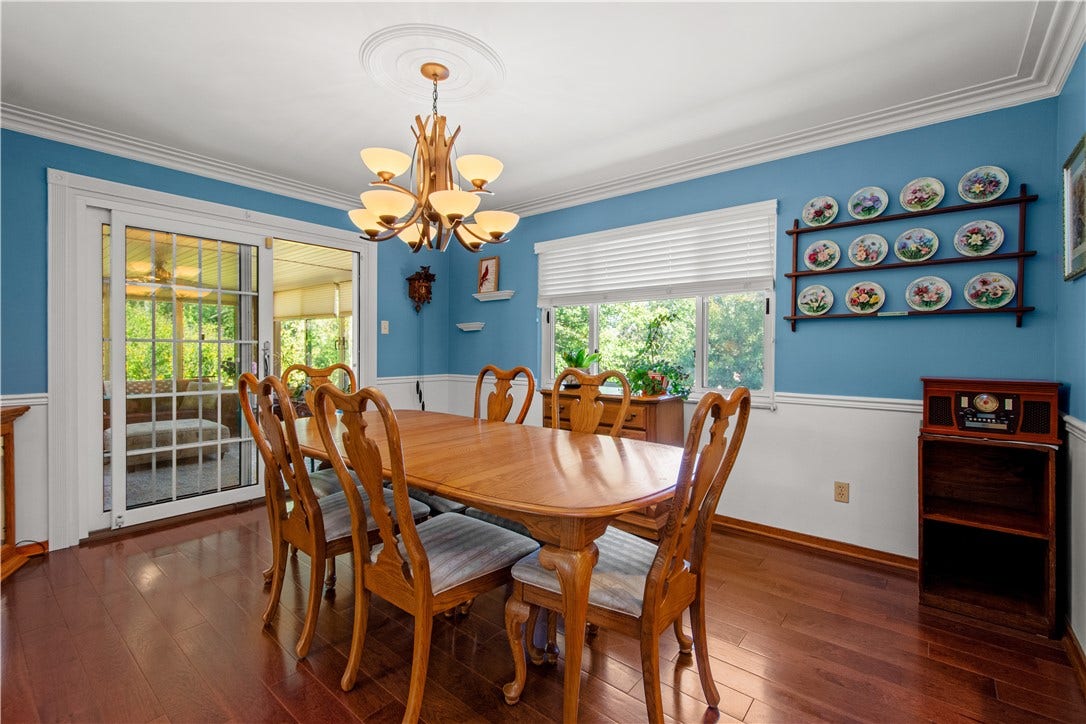 4742 Jewel Dr, Pittsburgh, PA 15236 Spacious dining room provides access to the dreamy sunroom.