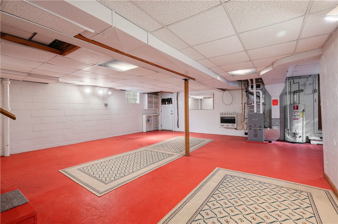 3942 Lawnview Ave, Pittsburgh, PA 15227 Endless potential in this wide open basement space. Walk out access thru door in left corner to yard with access to single car garage just to the right of water heater in photo