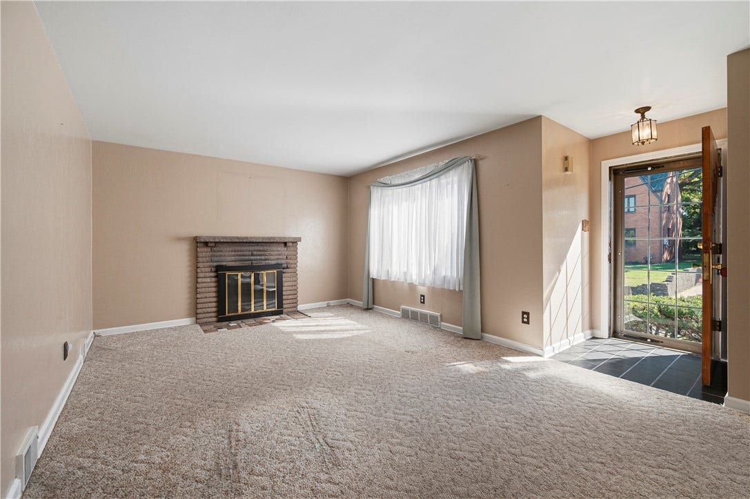 3942 Lawnview Ave, Pittsburgh, PA 15227 Spacious living room with operational wood burning fire place