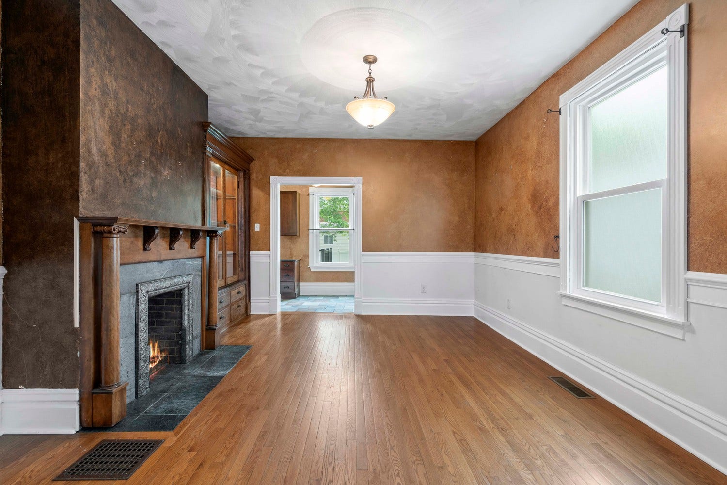 The Dining room with a decorative fireplace adds a cozy touch to dinner parties!