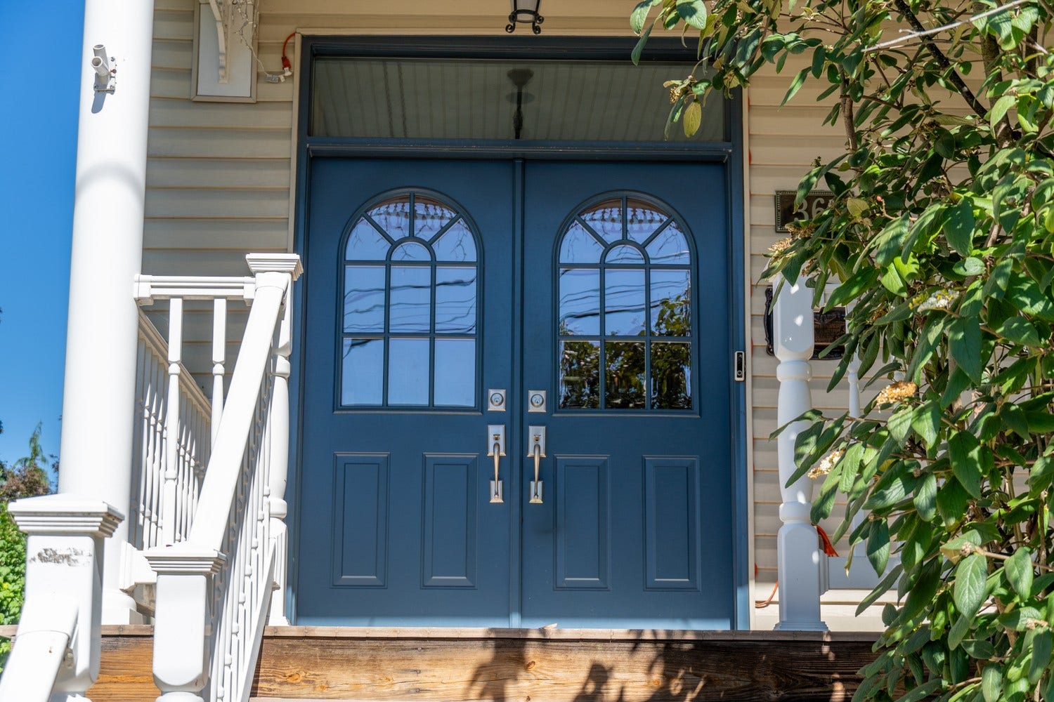 The Blue Doors Welcome you in!  New doors were added to add a "pop" of color to the covered front porch.