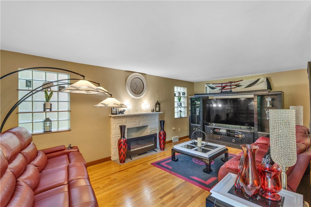 2709 Blackridge Avenue, Pittsburgh, PA 15235 Spacious living room with hardwood floors, decorative fireplace