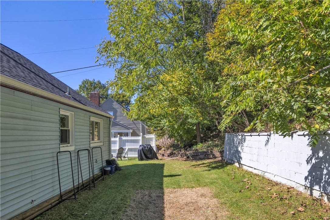 136 N Hazen Ave., Ellwood City, PA 16117 Mature trees line the backyard, offering privacy, shade, and visits from local wildlife.