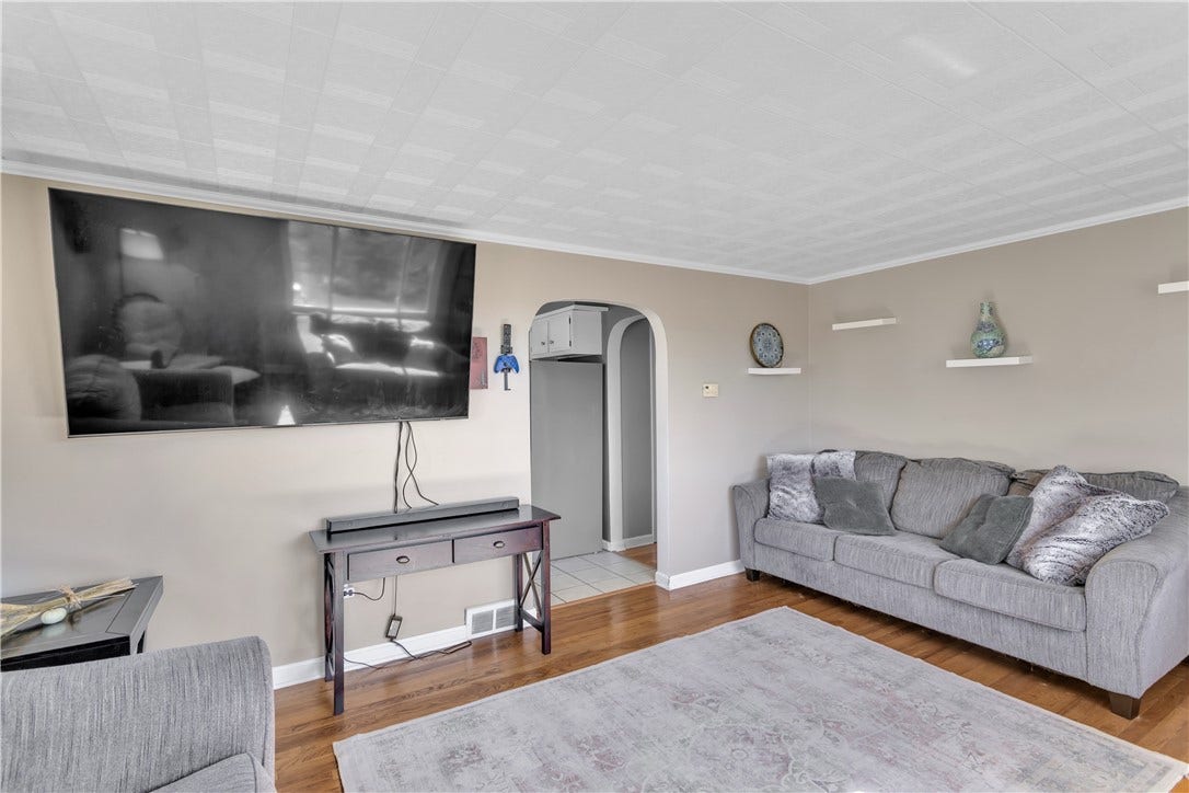 136 N Hazen Ave., Ellwood City, PA 16117 Arched doorways and crown molding add timeless character throughout the main living spaces.