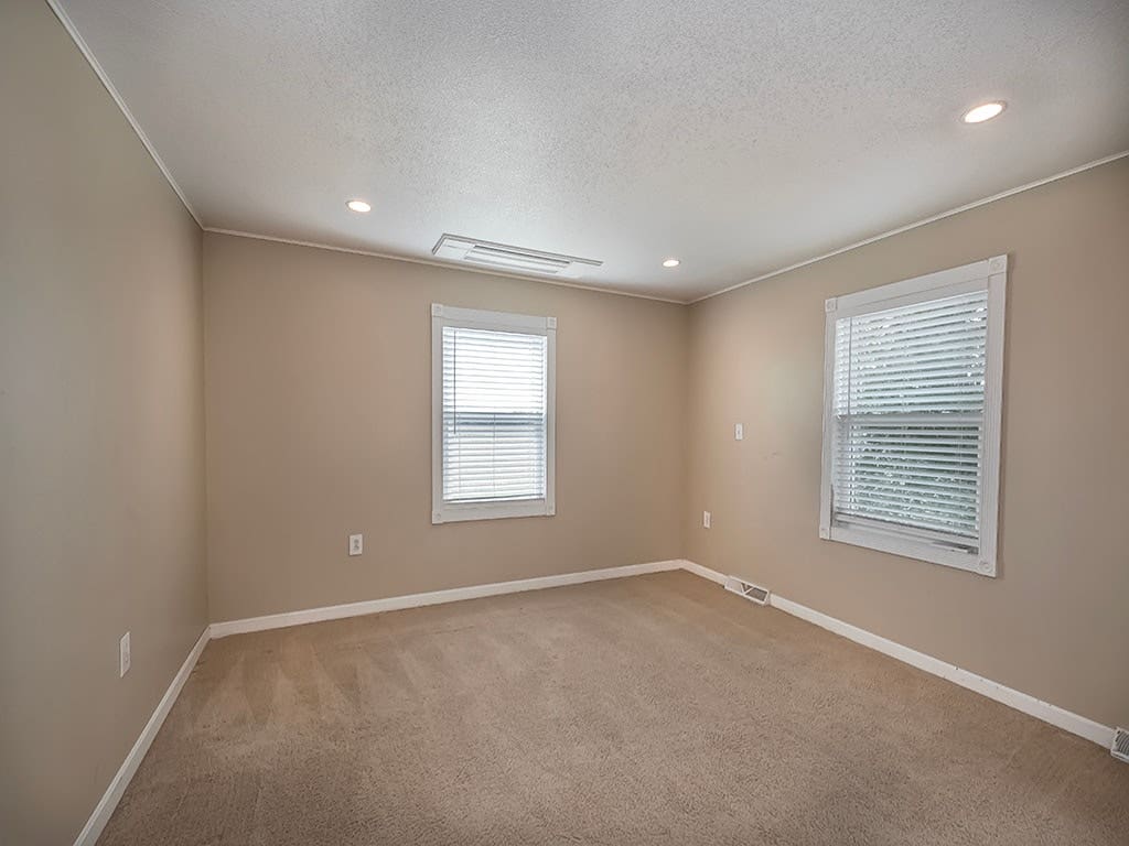 Primary suite with walk in closet and renovated en-suite bath