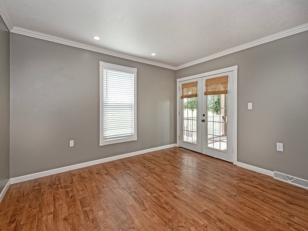 Office/Den with French doors leading out to the backyard stone patio